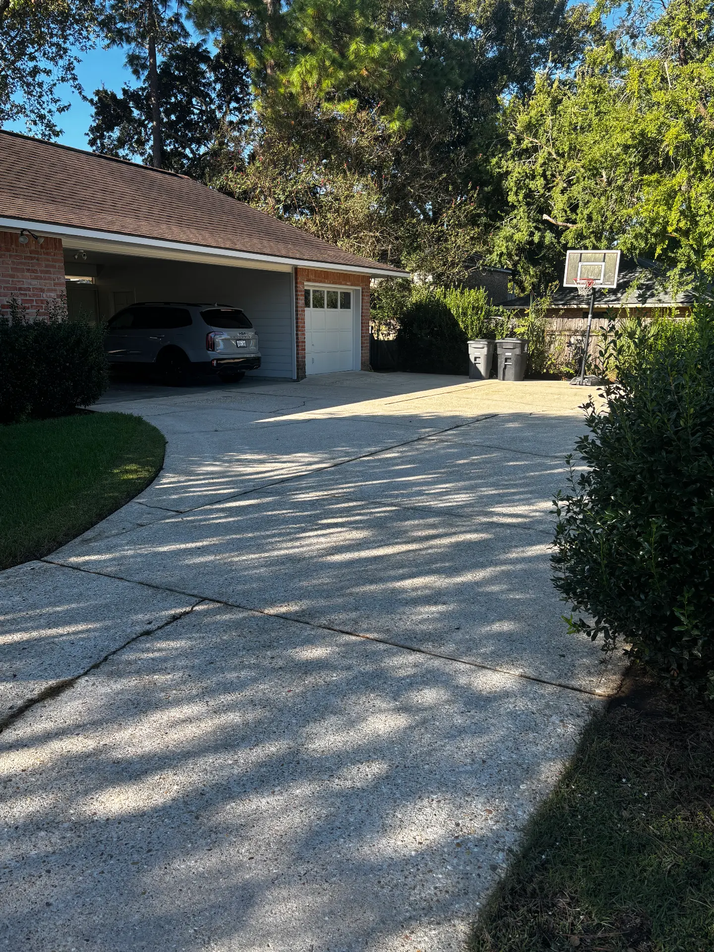 Back area of a driveway by the garage after cleaning
