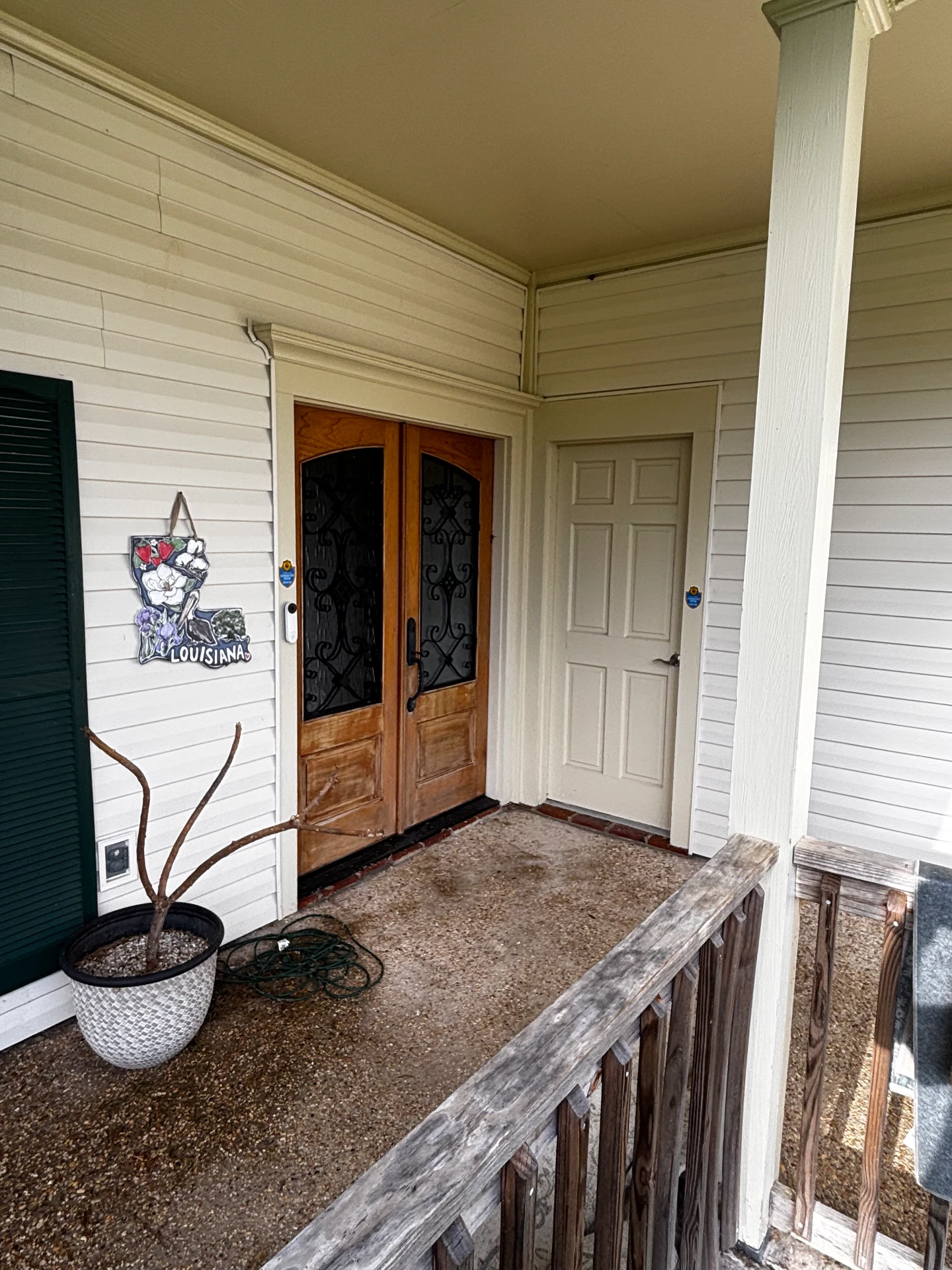 Front porch with wood doors after cleaning
